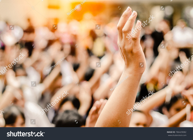 stock-photo-raising-hands-for-participation-vote-786429082.jpg